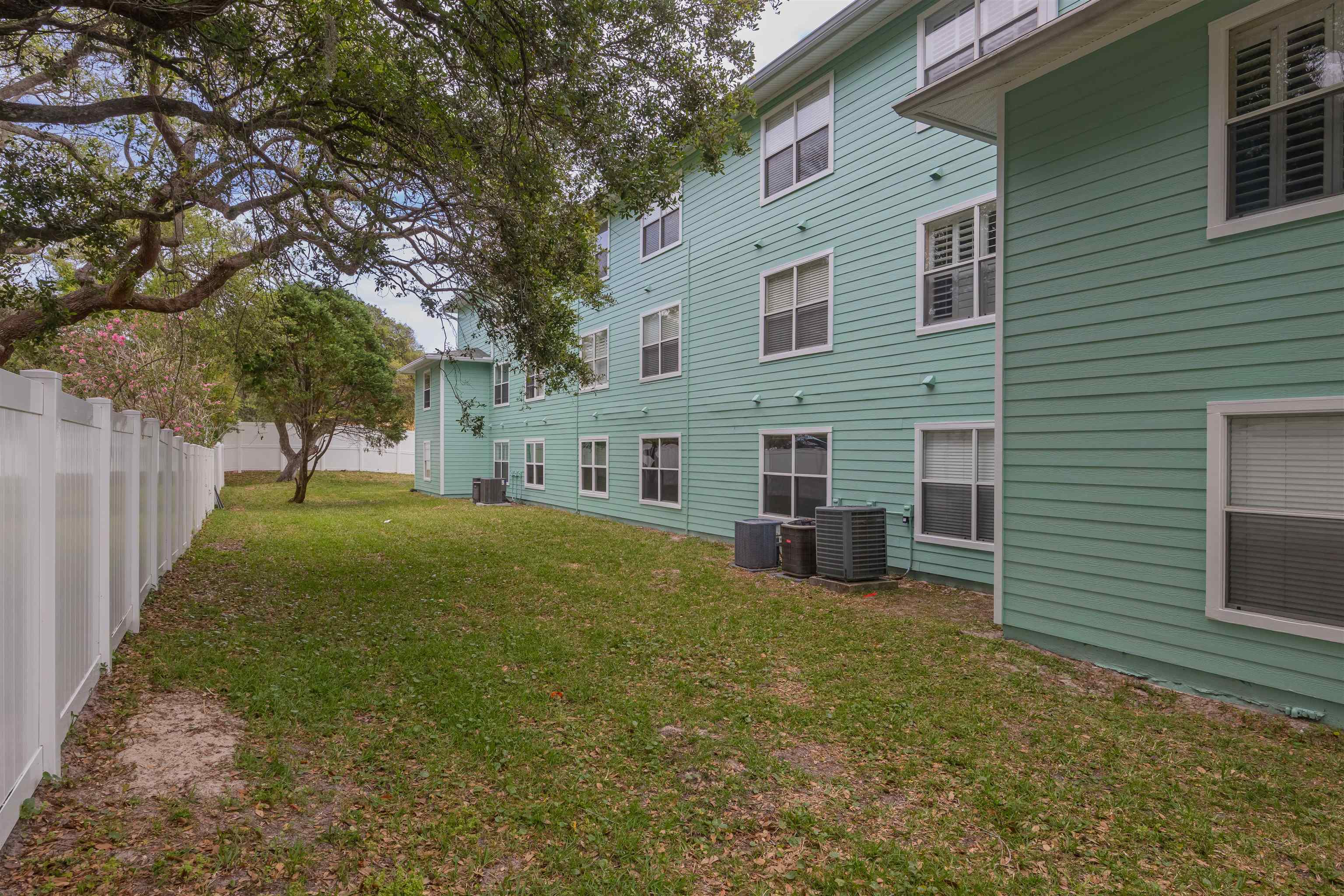 208 16th Street, Unit B St. Augustine, FL 32080 - Photo 30 of 68 a view of a house with backyard and a tree