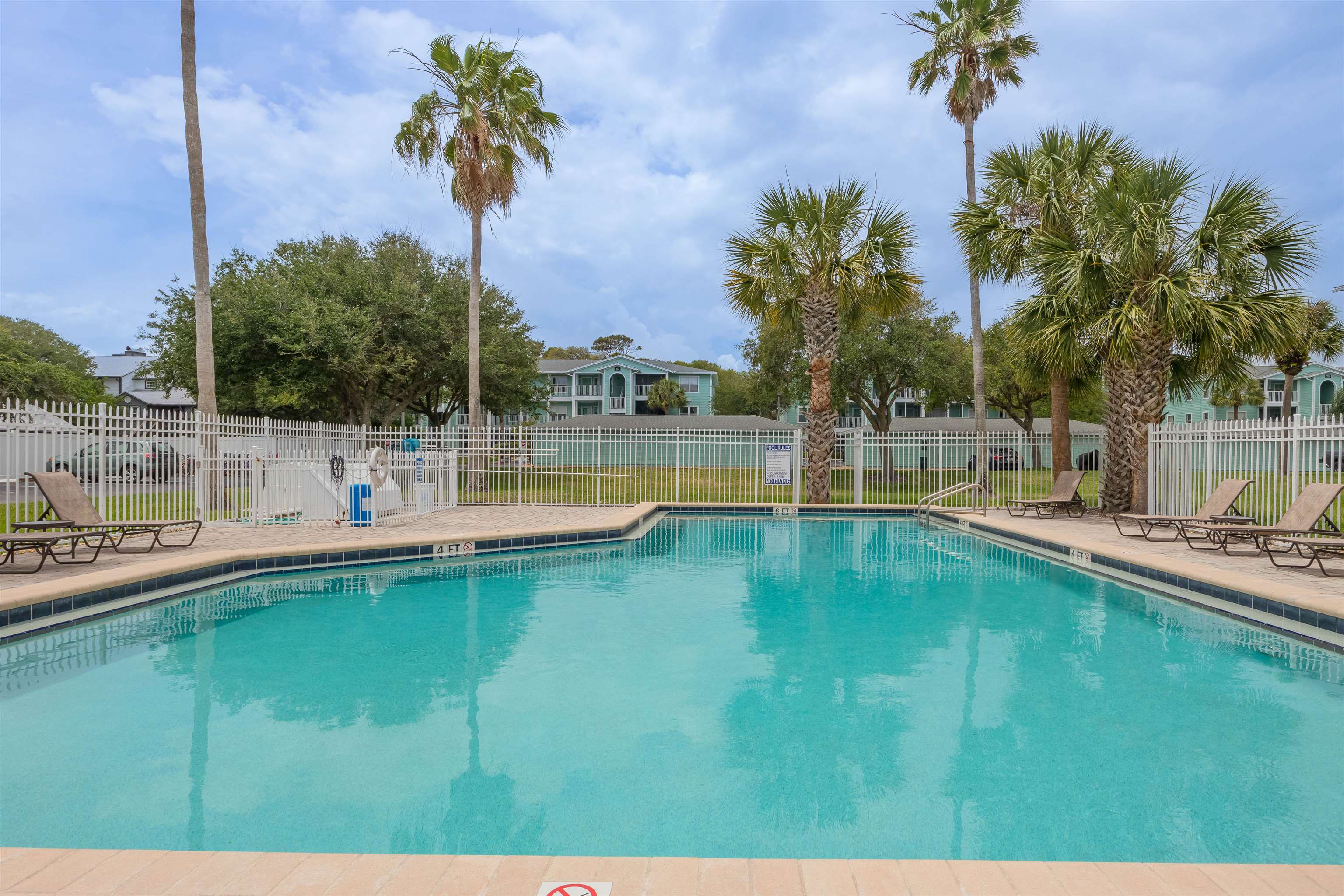 208 16th Street, Unit B St. Augustine, FL 32080 - Photo 31 of 68 a view of a swimming pool with a yard
