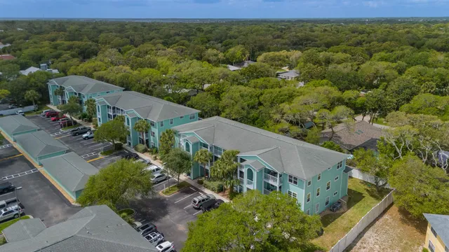an aerial view of residential building and ocean