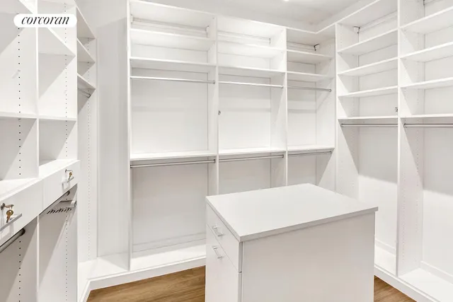 a room with a cabinets and a window