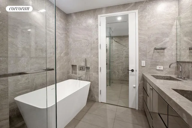 a bathroom with a bathtub and a sink