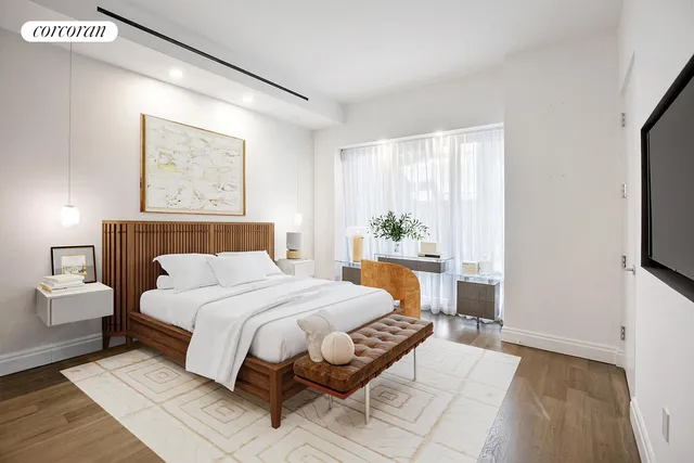 a bedroom with a large bed and a window