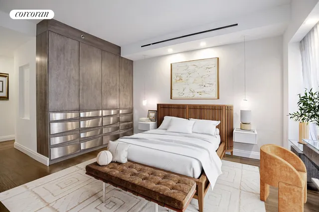 a bedroom with a large bed and a window