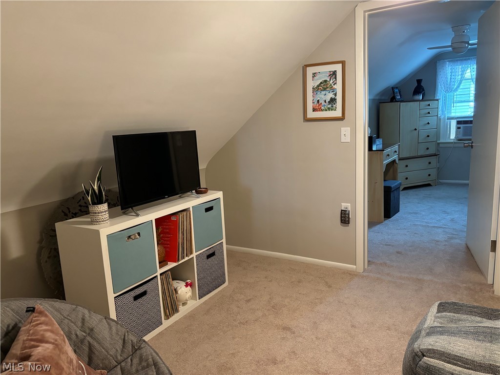 1440 West Miner Road Cleveland, OH 44124 - Photo 33 of 49 Game room featuring lofted ceiling, light colored carpet, cooling unit, and ceiling fan