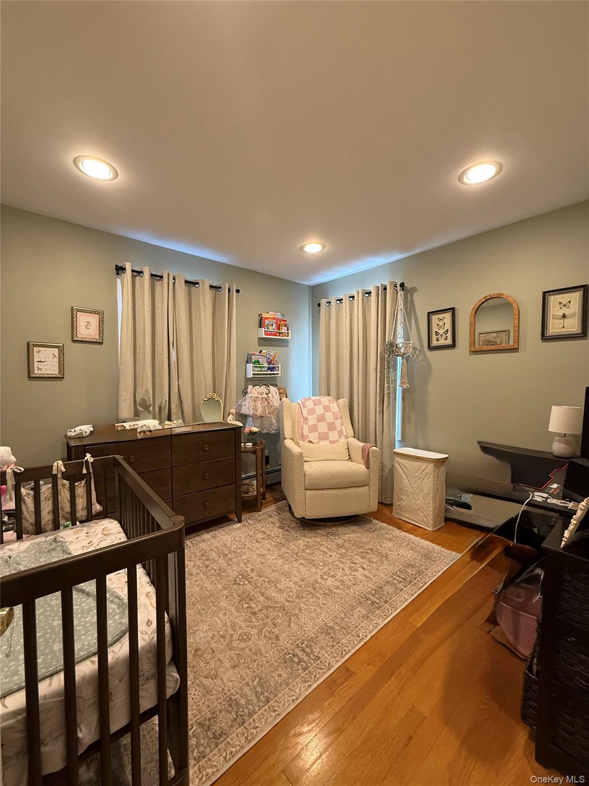 1009 Huckleberry Road North Bellmore, NY 11710 - Photo 17 of 24 a bedroom with furniture and a window