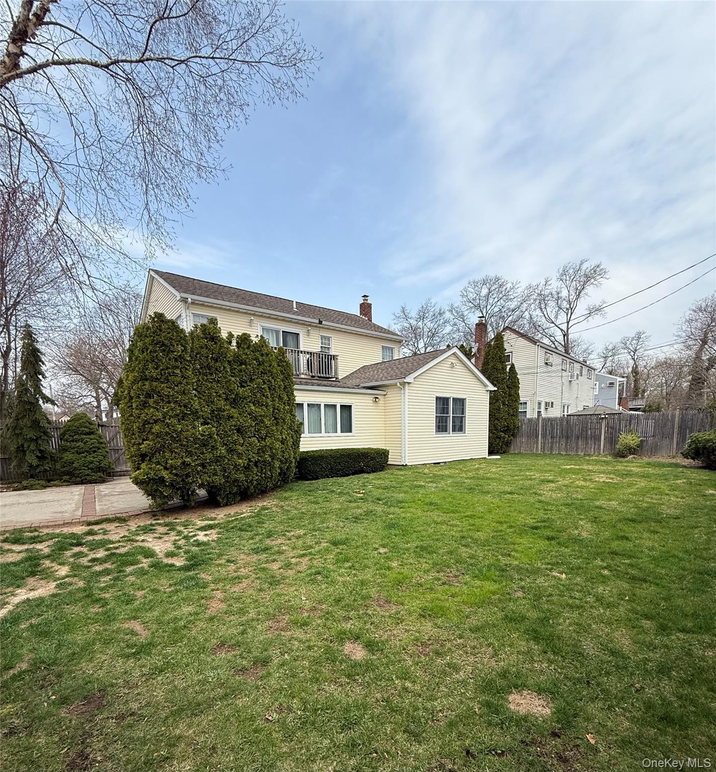 1009 Huckleberry Road North Bellmore, NY 11710 - Photo 23 of 24 a view of a yard in front of a house