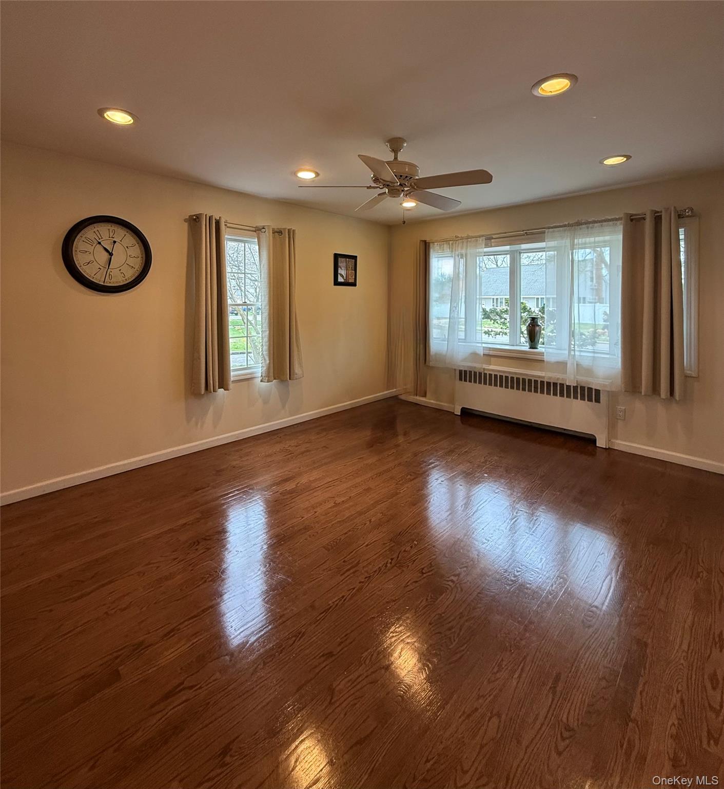1009 Huckleberry Road North Bellmore, NY 11710 - Photo 4 of 24 a view of empty room with wooden floor and fan