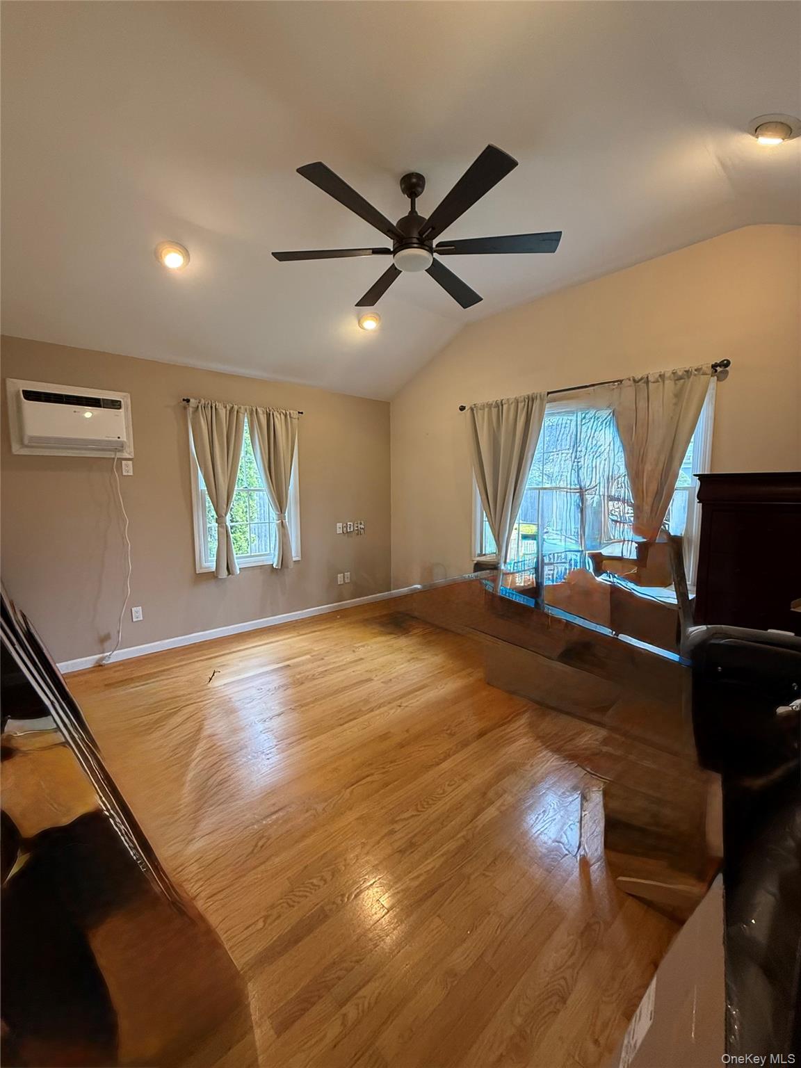 1009 Huckleberry Road North Bellmore, NY 11710 - Photo 9 of 24 a view of an empty room and wooden floor