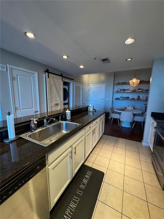3040 Peachtree Road Northwest, Unit 707 Atlanta, GA 30305 - Photo 11 of 38 a kitchen with stainless steel appliances granite countertop a sink and cabinets