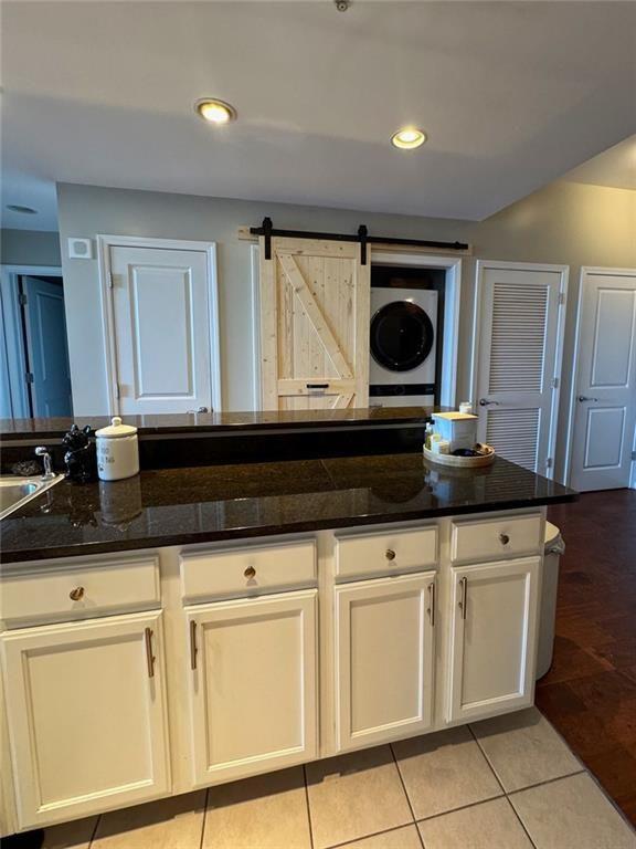 3040 Peachtree Road Northwest, Unit 707 Atlanta, GA 30305 - Photo 12 of 38 a kitchen with white cabinets and sink
