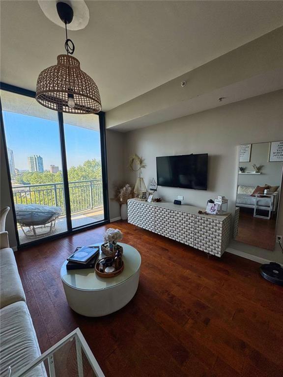 3040 Peachtree Road Northwest, Unit 707 Atlanta, GA 30305 - Photo 15 of 38 a bedroom with furniture and a window