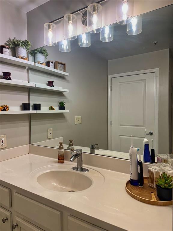 3040 Peachtree Road Northwest, Unit 707 Atlanta, GA 30305 - Photo 18 of 38 a bathroom with a double vanity sink