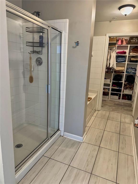 3040 Peachtree Road Northwest, Unit 707 Atlanta, GA 30305 - Photo 20 of 38 a bathroom with a shower