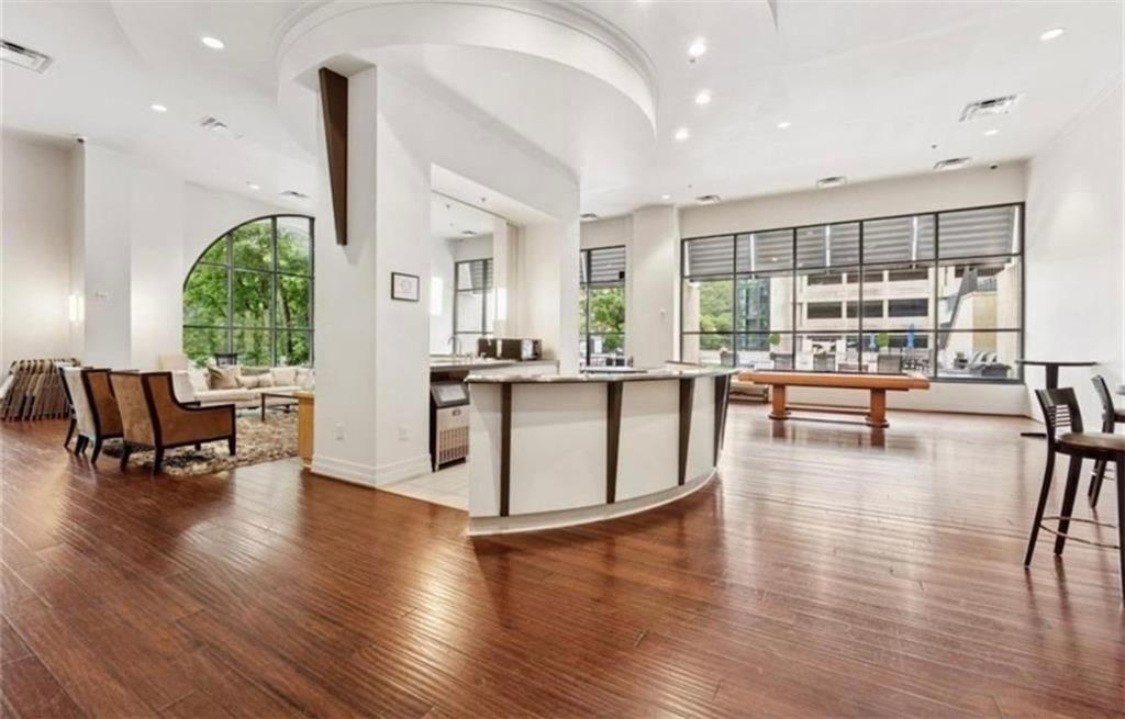 3040 Peachtree Road Northwest, Unit 707 Atlanta, GA 30305 - Photo 33 of 38 a living room with furniture and a large window