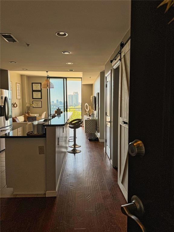 3040 Peachtree Road Northwest, Unit 707 Atlanta, GA 30305 - Photo 7 of 38 a living room with furniture floor to ceiling window and wooden floor