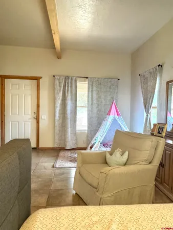 a bathroom with a sink toilet and a window