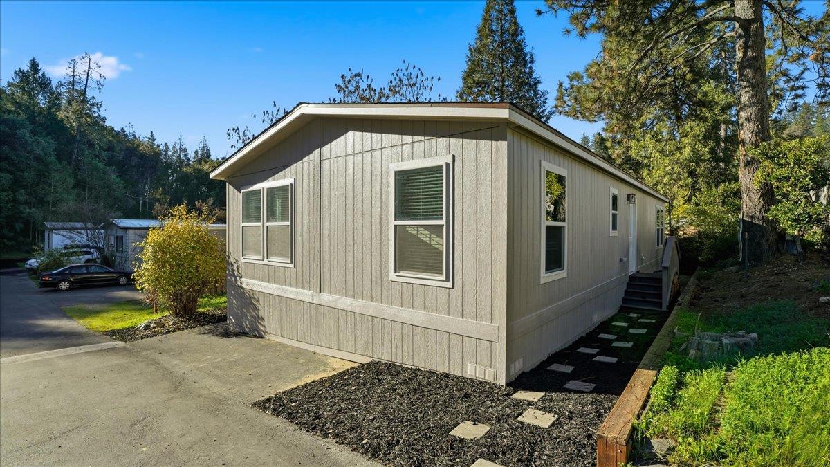 135 Ponderosa Way, Unit 14 Colfax, CA 95713 - Photo 2 of 37 a view of a house with backyard and trees around