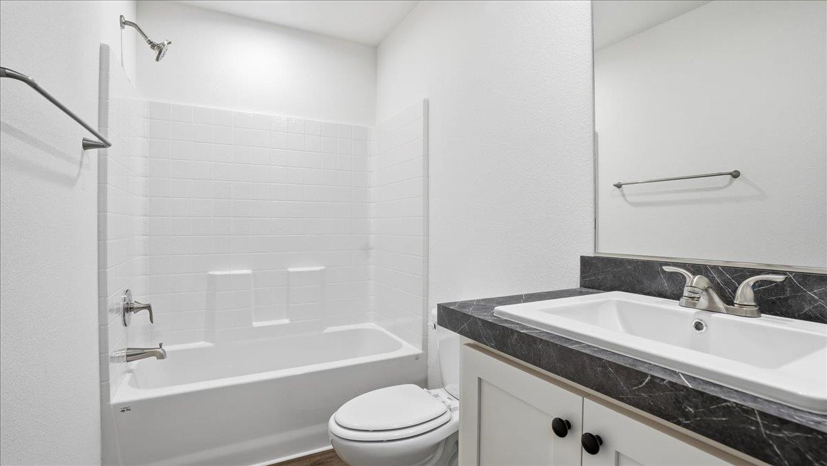 135 Ponderosa Way, Unit 14 Colfax, CA 95713 - Photo 22 of 37 a bathroom with a granite countertop sink toilet and shower