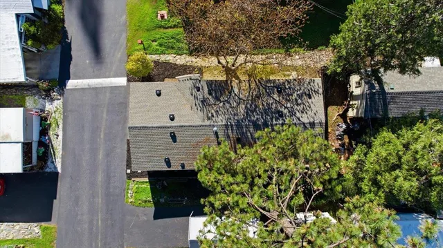 a aerial view of a house with a yard and garden