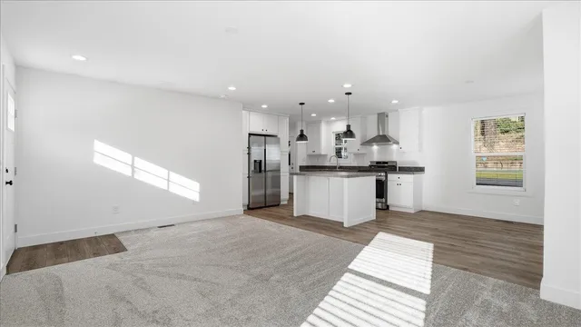 a view of kitchen with wooden floor