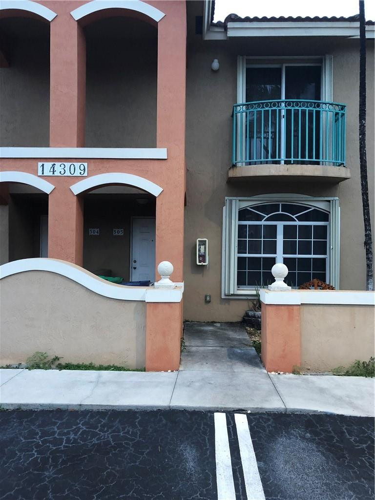 a view of outdoor space with a barbeque grill and a fireplace