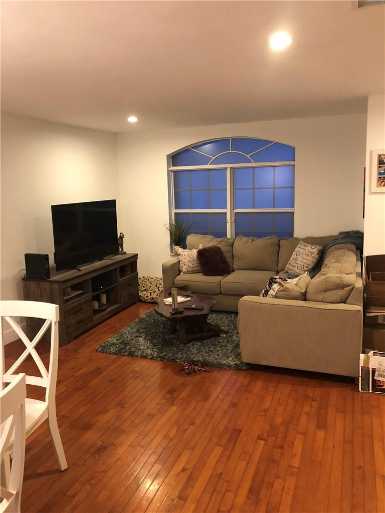 14309 Southwest 96th Street, Unit 505 Miami, FL 33186 - Photo 2 of 11 a living room with furniture and a flat screen tv