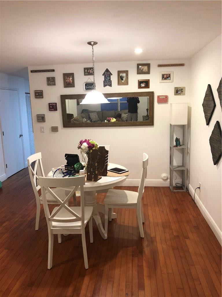 14309 Southwest 96th Street, Unit 505 Miami, FL 33186 - Photo 3 of 11 a dining room with furniture and wooden floor