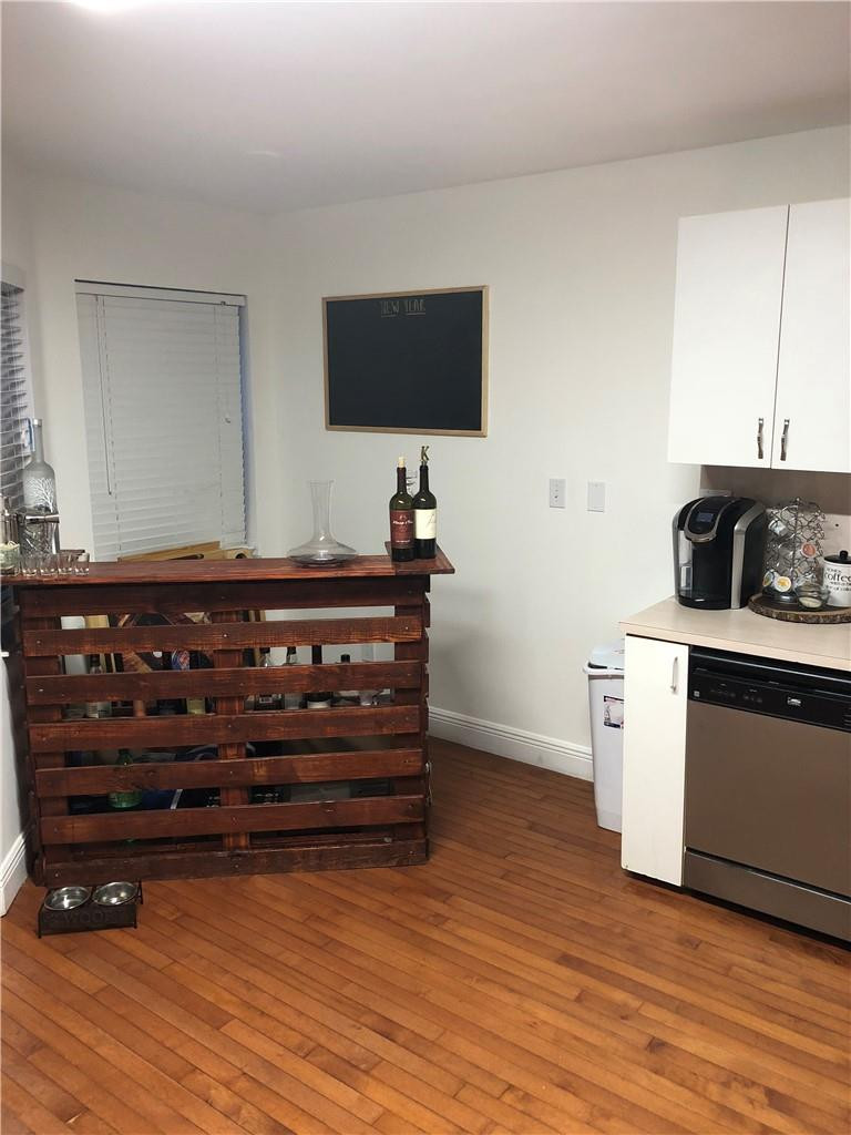 14309 Southwest 96th Street, Unit 505 Miami, FL 33186 - Photo 5 of 11 a kitchen with a stove and a flat screen tv