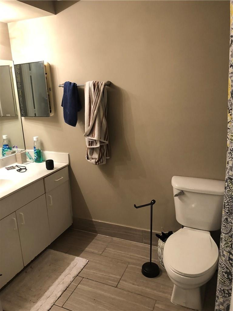 14309 Southwest 96th Street, Unit 505 Miami, FL 33186 - Photo 7 of 11 a bathroom with a toilet and a sink