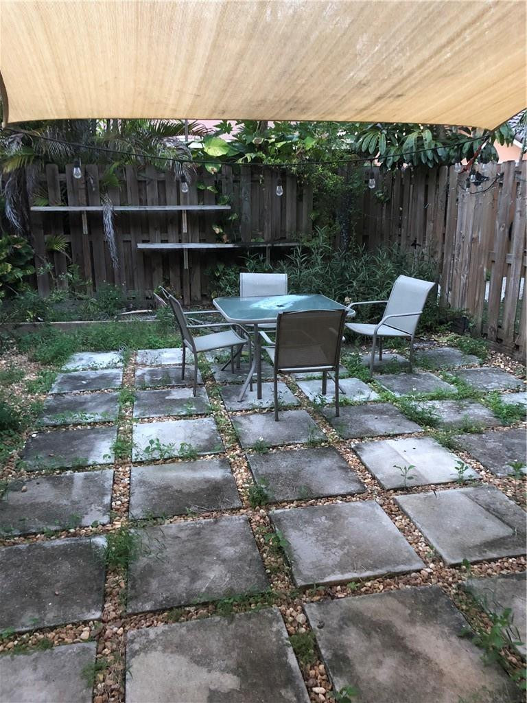 14309 Southwest 96th Street, Unit 505 Miami, FL 33186 - Photo 10 of 11 a view of a bench in the backyard