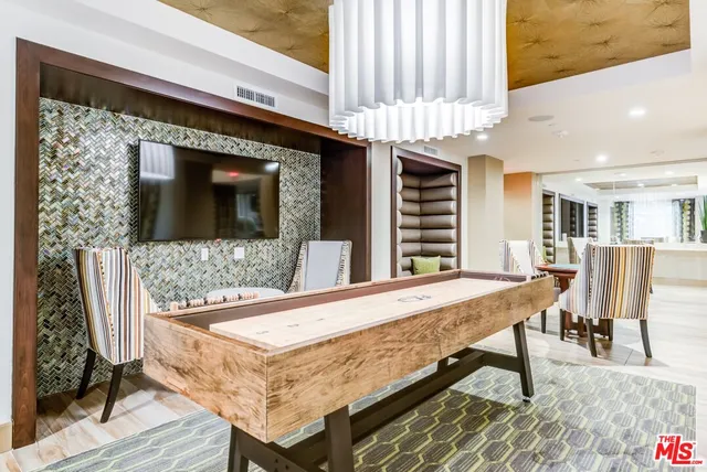 a dining room with a table and chairs