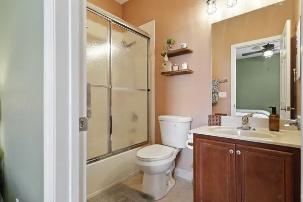 a bathroom with a toilet sink and shower