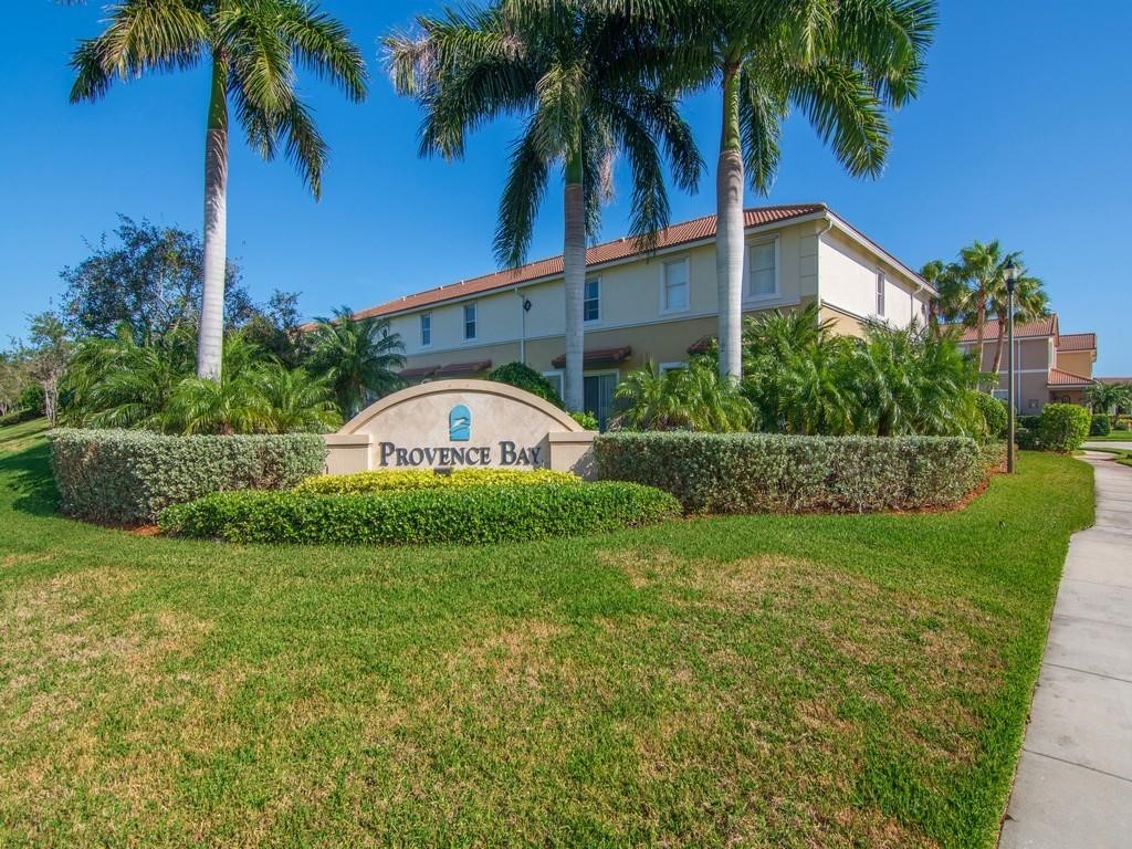 263 Provence Place Vero Beach, FL 32960 - Photo 22 of 33 a front view of a house with garden
