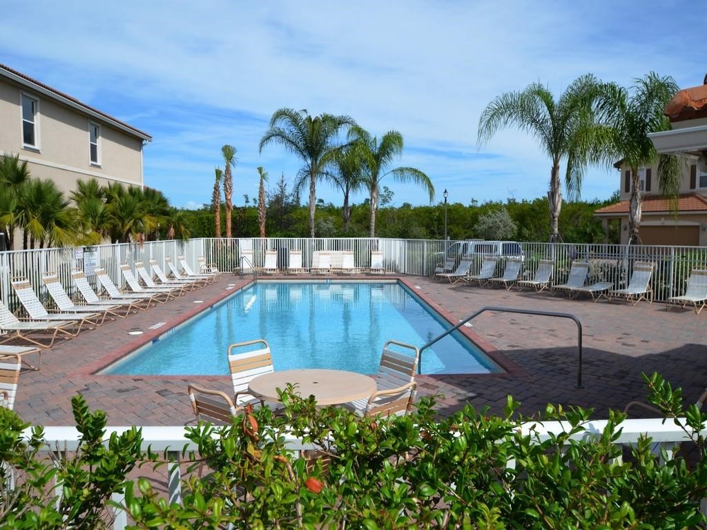 263 Provence Place Vero Beach, FL 32960 - Photo 25 of 33 a swimming pool with outdoor seating and yard