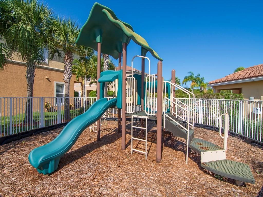 263 Provence Place Vero Beach, FL 32960 - Photo 26 of 33 a view of a chairs setting in the backyard of a house