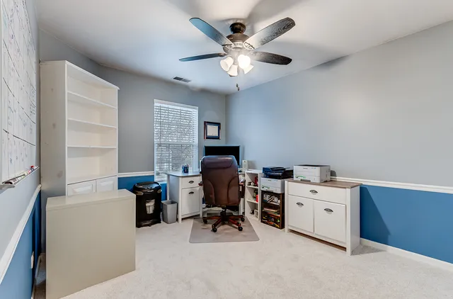 a view of workspace with wooden floor