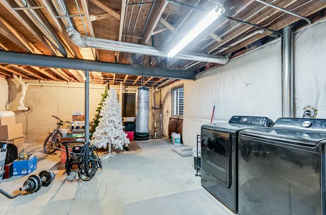 a view of gym equipment with racks on the wall
