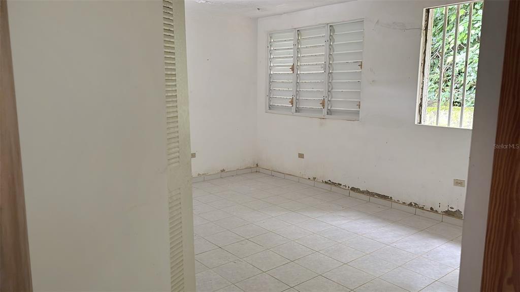 730 Carr Km Cayey, Cayey 00736 - Photo 8 of 17 an empty room with windows