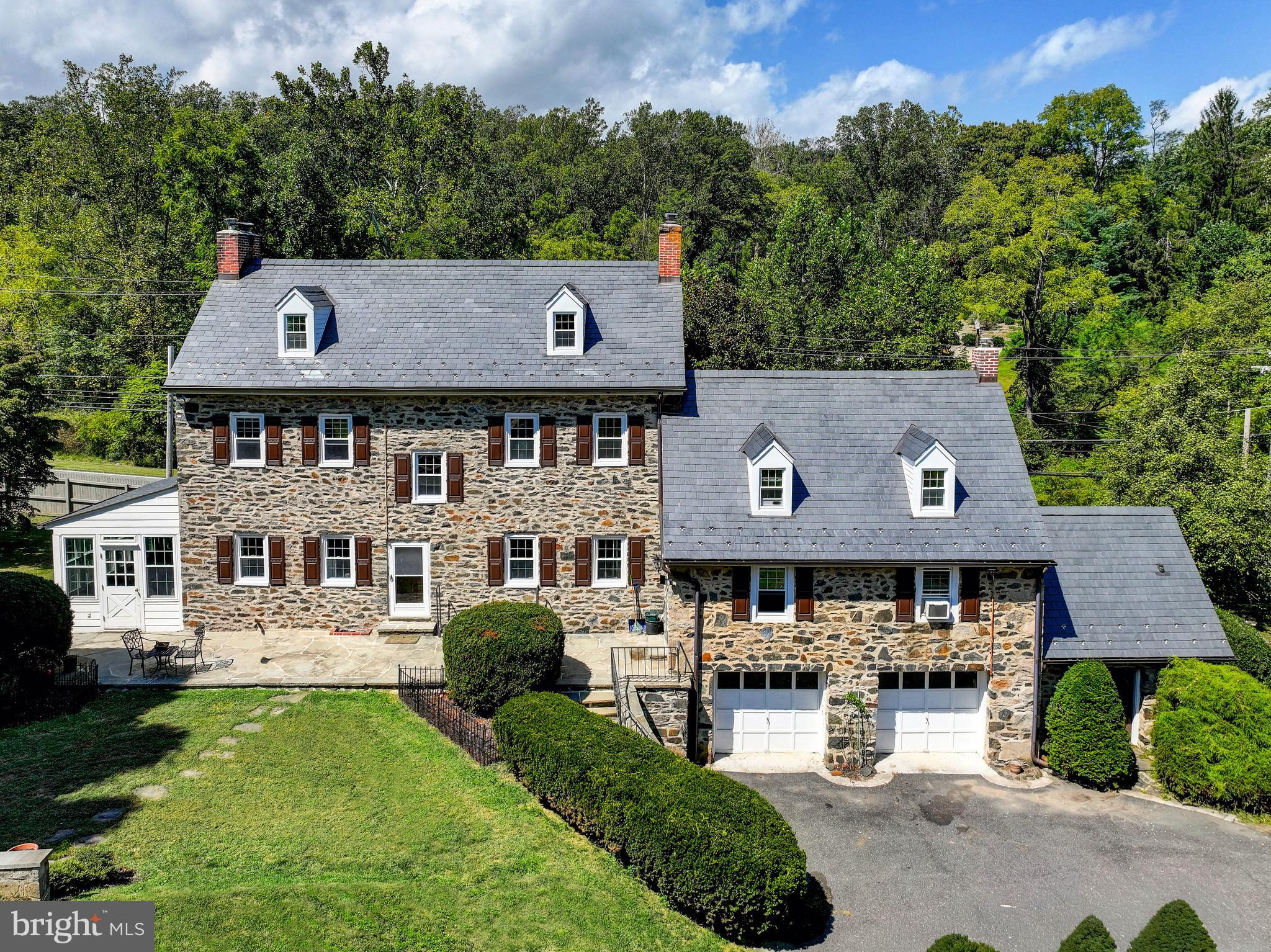 12801 Harford Road Hydes, MD 21082 - Photo 13 of 20 an aerial view of a house with yard and trees in the background