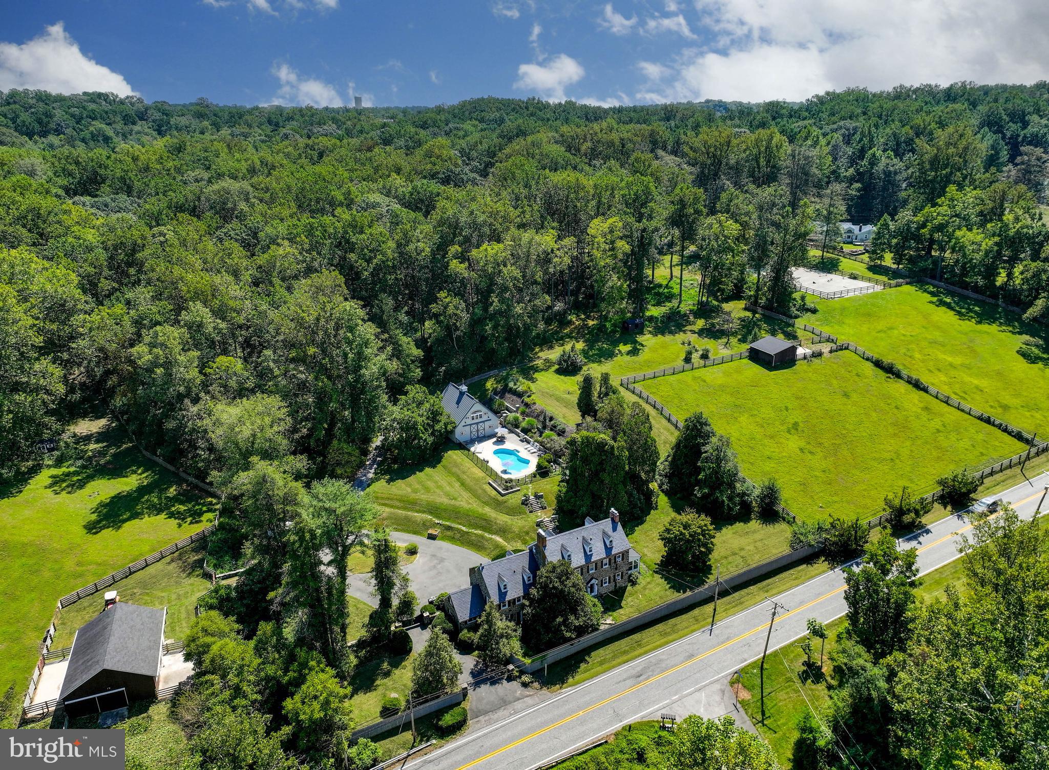 12801 Harford Road Hydes, MD 21082 - Photo 4 of 20 an aerial view of a house with a yard and lake