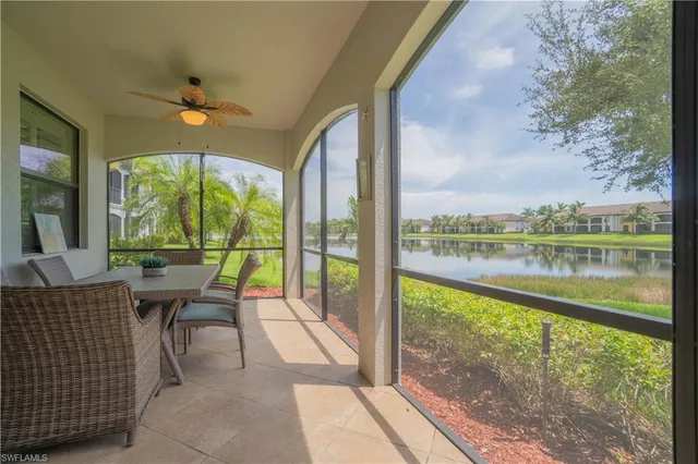 a view of a dining room with furniture and a chandelier