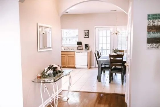 a view of a dining room with furniture and wooden floor