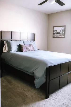 a bedroom with a bed and a cabinets