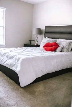 a bedroom with a bed and closet