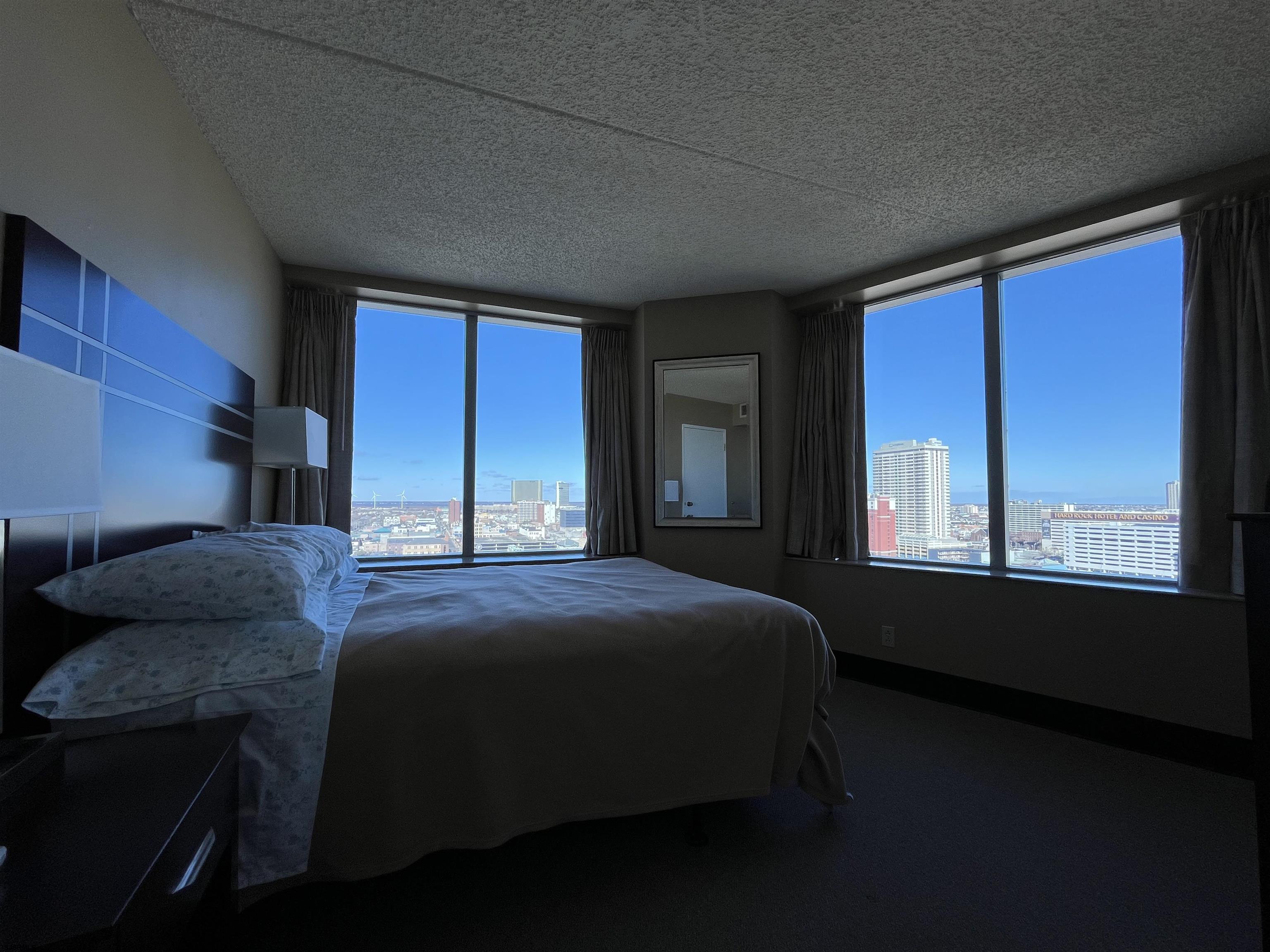 1515 Boardwalk, Unit 1711 Atlantic City, NJ 08401 - Photo 6 of 10 a bedroom with a bed next to a window