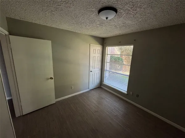 an empty room with a empty space and windows