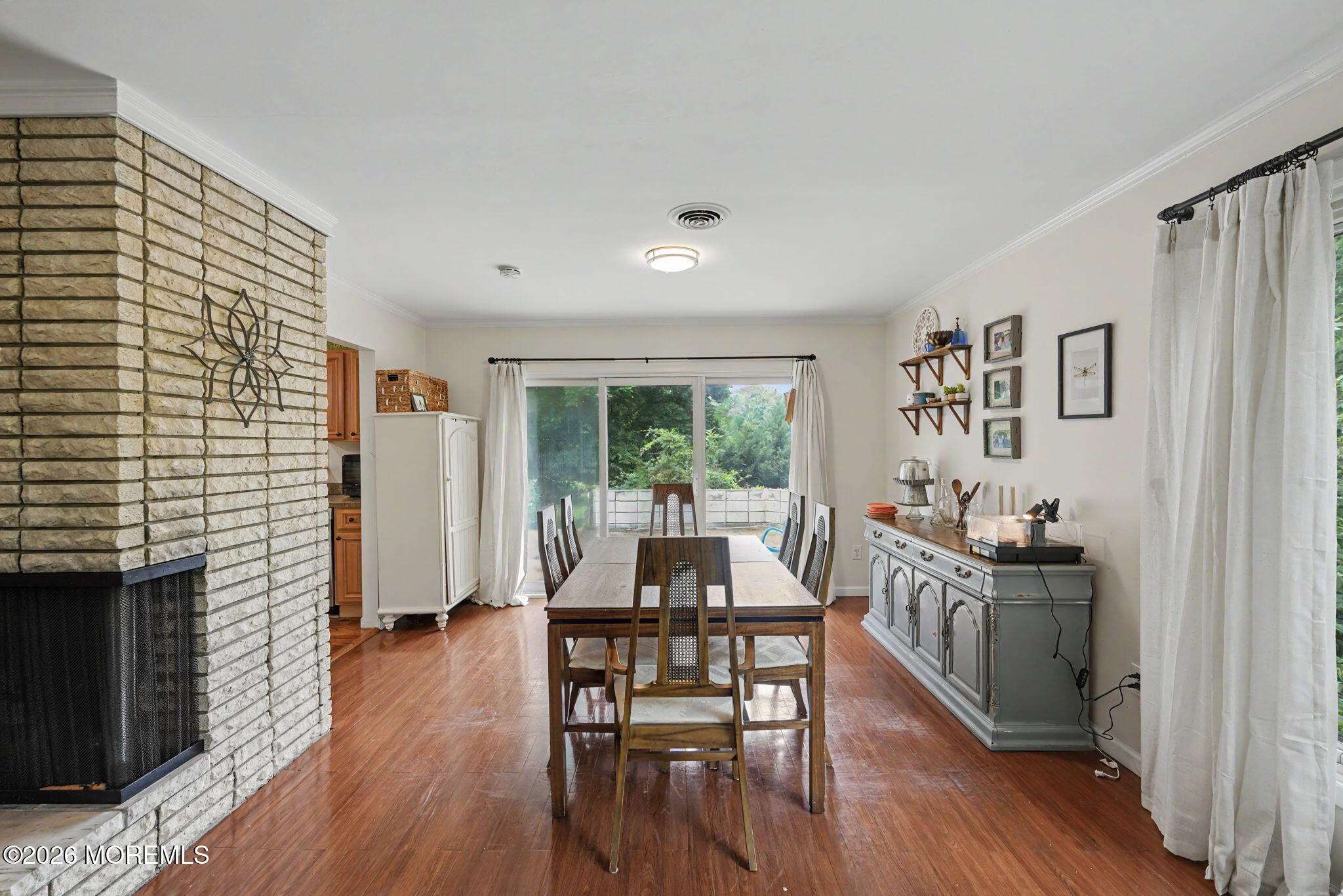 699 Aldrich Road Howell, NJ 07731 - Photo 10 of 30 a dining room with furniture and wooden floor