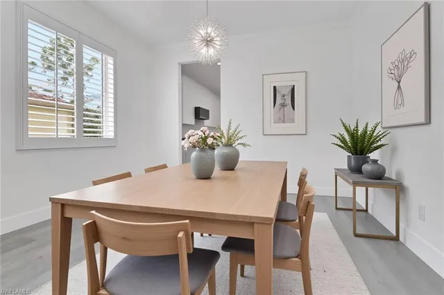 a dining room with furniture and window