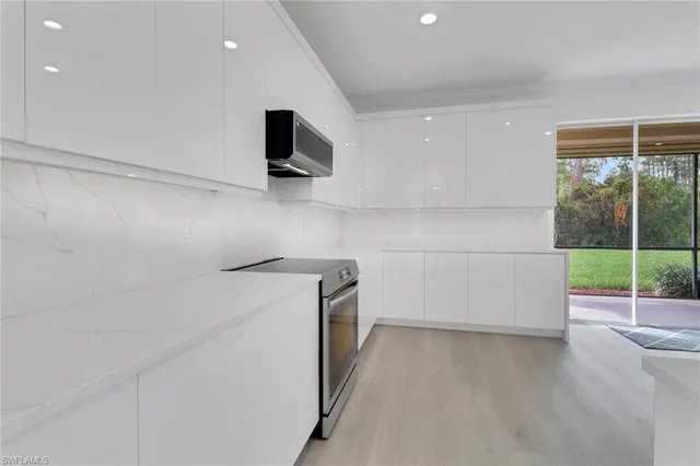 a view of storage and utility room with wooden floor