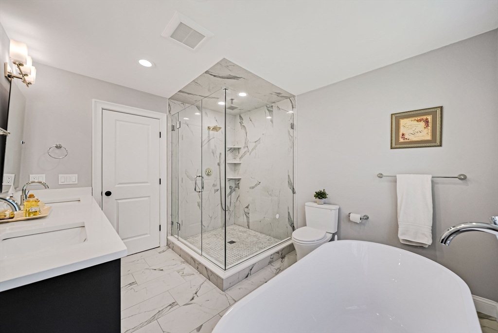 17 Sunrise Terrace Needham, MA 02492 - Photo 19 of 42 a spacious bathroom with a shower sink and mirror